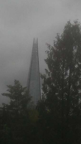 Gloomy black and white image of the Shard on the South Bank of the Thames in London
