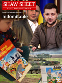 Volodomyr Zelensky and Vitaly Klitschko look out over a caption - Indomitable - and a child reading Asterix books with a background of thundering Leopard 2 main battle tanks.